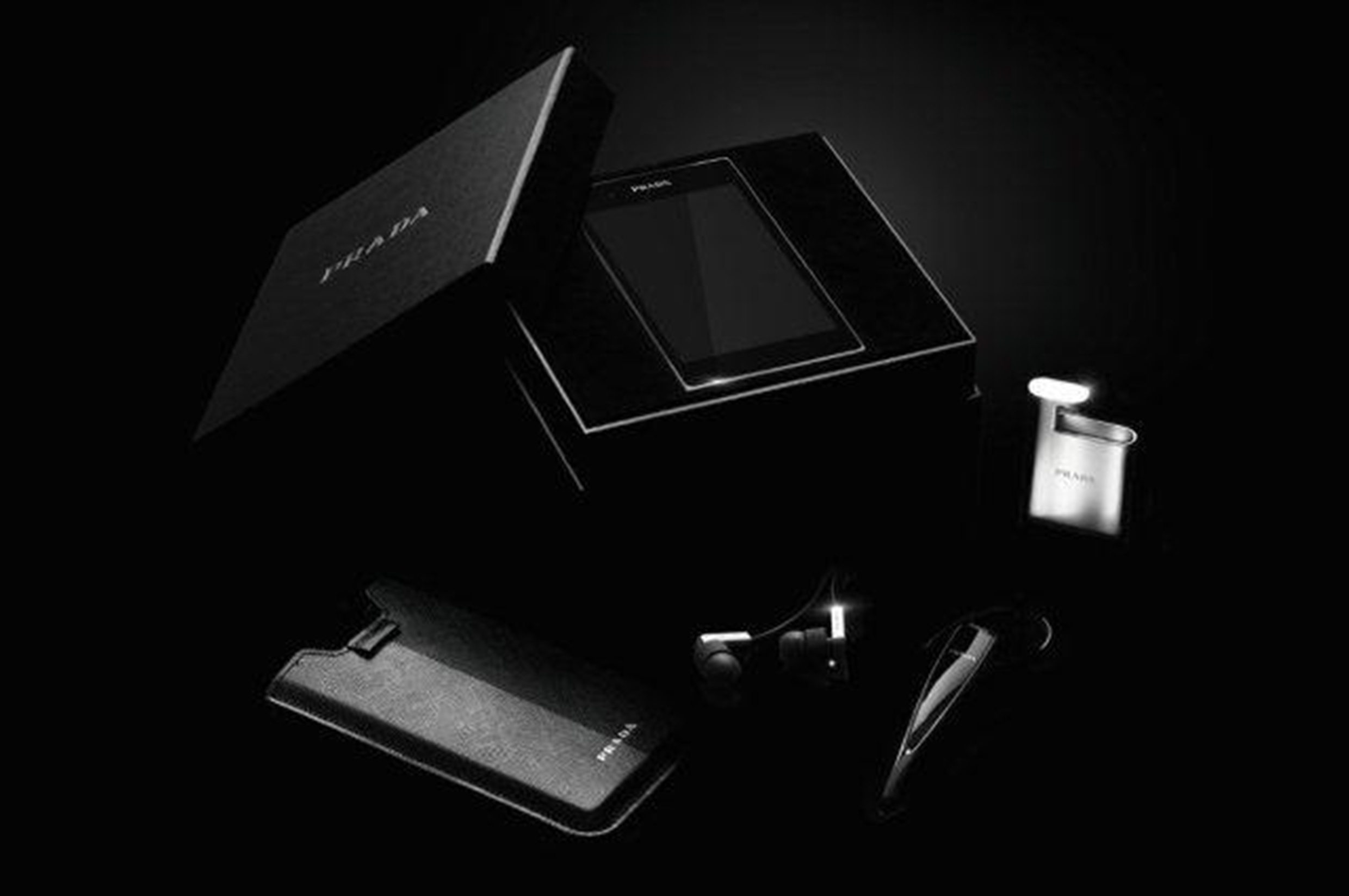 All components of the PRADA phone by LG 3.0 including PRADA branded box, back cover case, cradle and Bluetooth ear set are displayed
