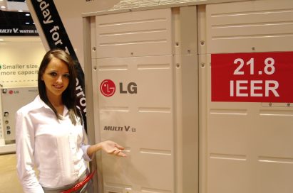 A woman posing in front of the LG Multi V III air conditioner