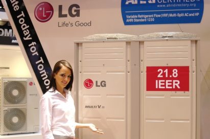 Another view of a woman posing in front of the LG Multi V III air conditioner