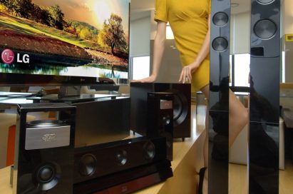 A model poses with LG 3D SOUND HTS and the LG CINEMA 3D Smart TV