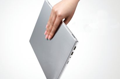 A person effortlessly carries the LG Ultrabook model Z330 with just one hand