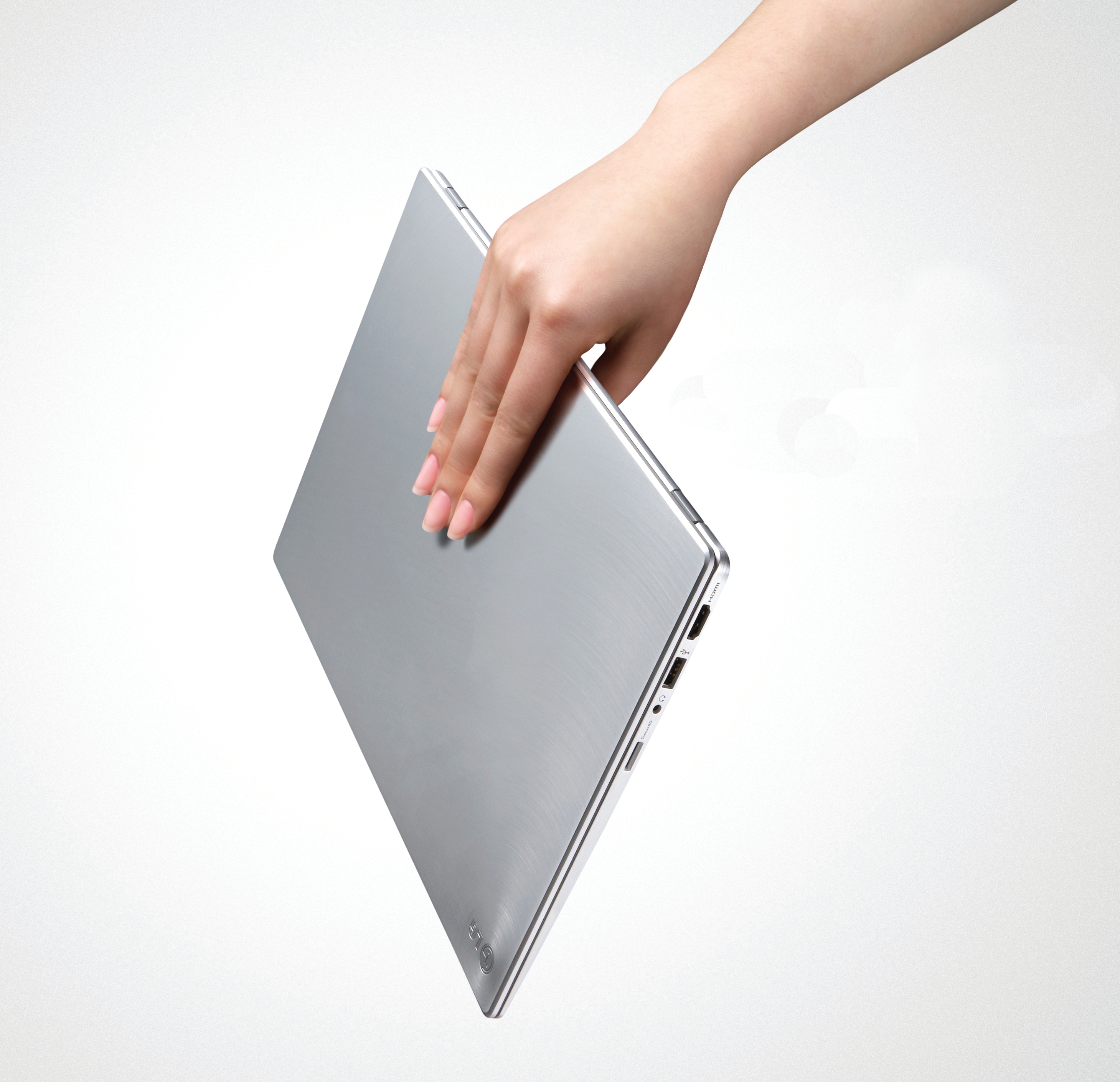 A person effortlessly carries the LG Ultrabook model Z330 with just one hand