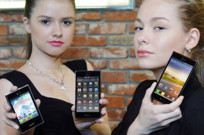 Two female models hold LG Optimus L3, LG Optimus L5 and LG Optimus L7 and show its front views
