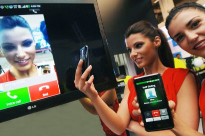 Two models demonstrating the world’s first voice-to-video conversion over an LTE network via LG smartphones