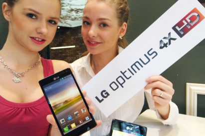 Two models hold up a LG Optimus 4X HD each while one also holds up the LG Optimus 4X HD logo in her other hand