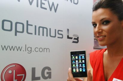 A female model holds an LG new Optimus L3 designed with the L Style design in mind.