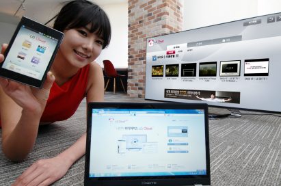 A model introduces the LG Cloud service which is compatible with TVs, mobile devices and PCs while lying down on the floor