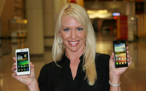 LG Smartphones at CTIA 2012 (1) A female model holds white and black LG smartphones and shows its front views