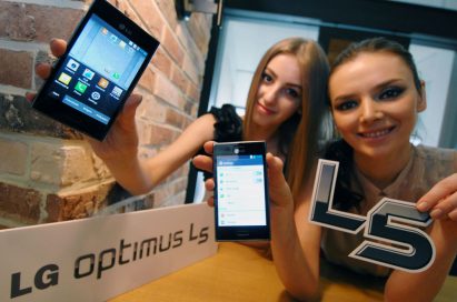 Two women each holding a stylish LG OPTIMUS L5