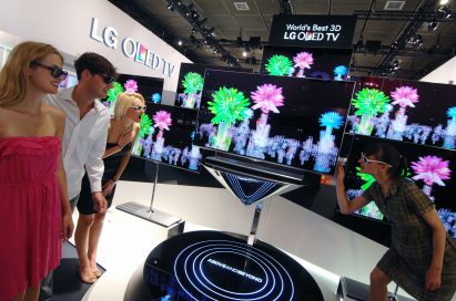 Visitors to LG’s booth experiencing the company’s 3D OLED TVs at IFA 2012