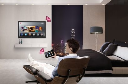 A gentleman using the LG Pro-Centric® Smart Hotel TV in his room