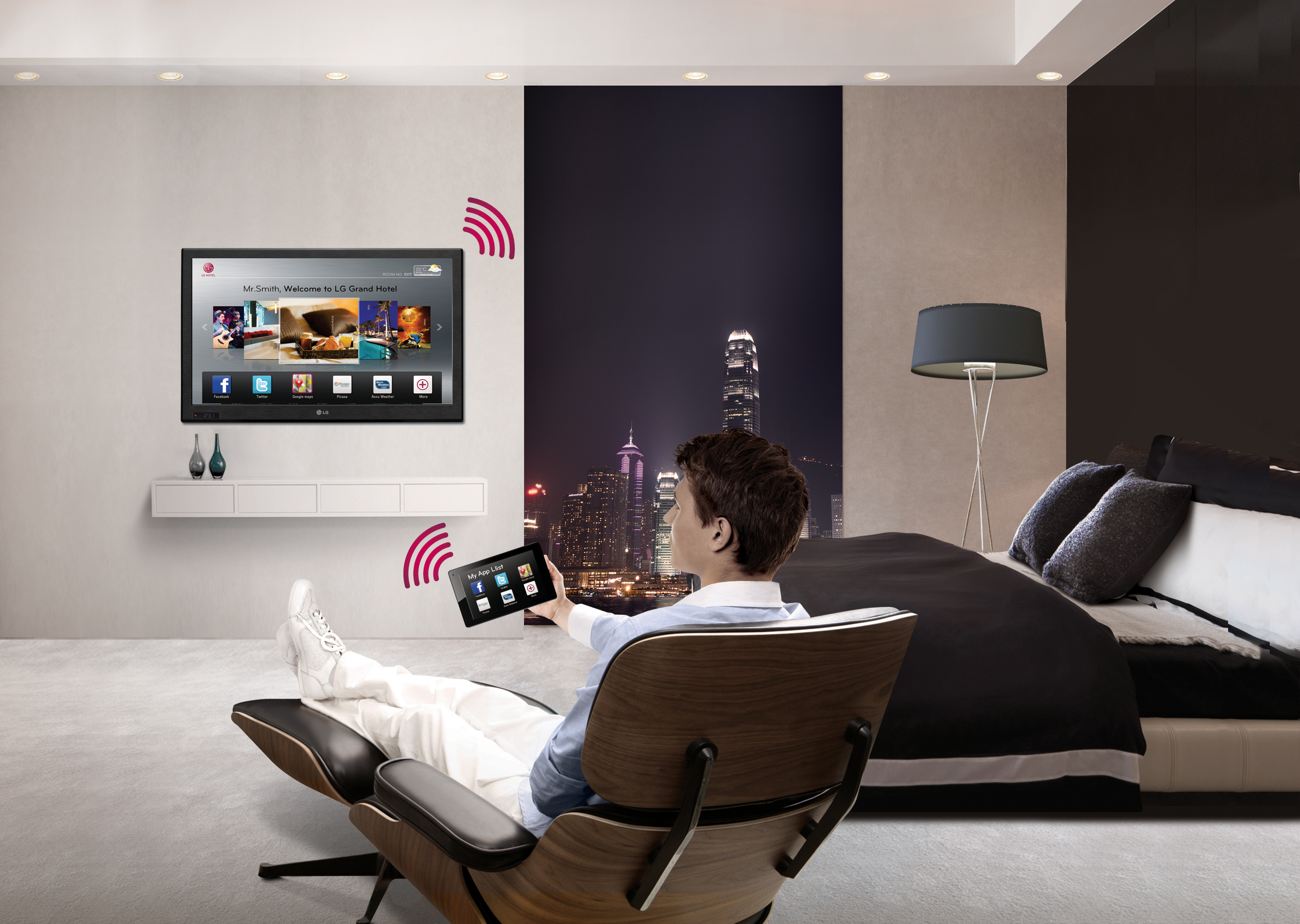 A gentleman using the LG Pro-Centric® Smart Hotel TV in his room