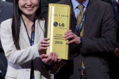 Kim Eun-jung, director of LG Electronics and Song Ki-ju, CEO of LG Electronics Germany hold the PLUS X Award together