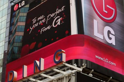 A Times Square billboard saying “To me, you are perfect. From G”