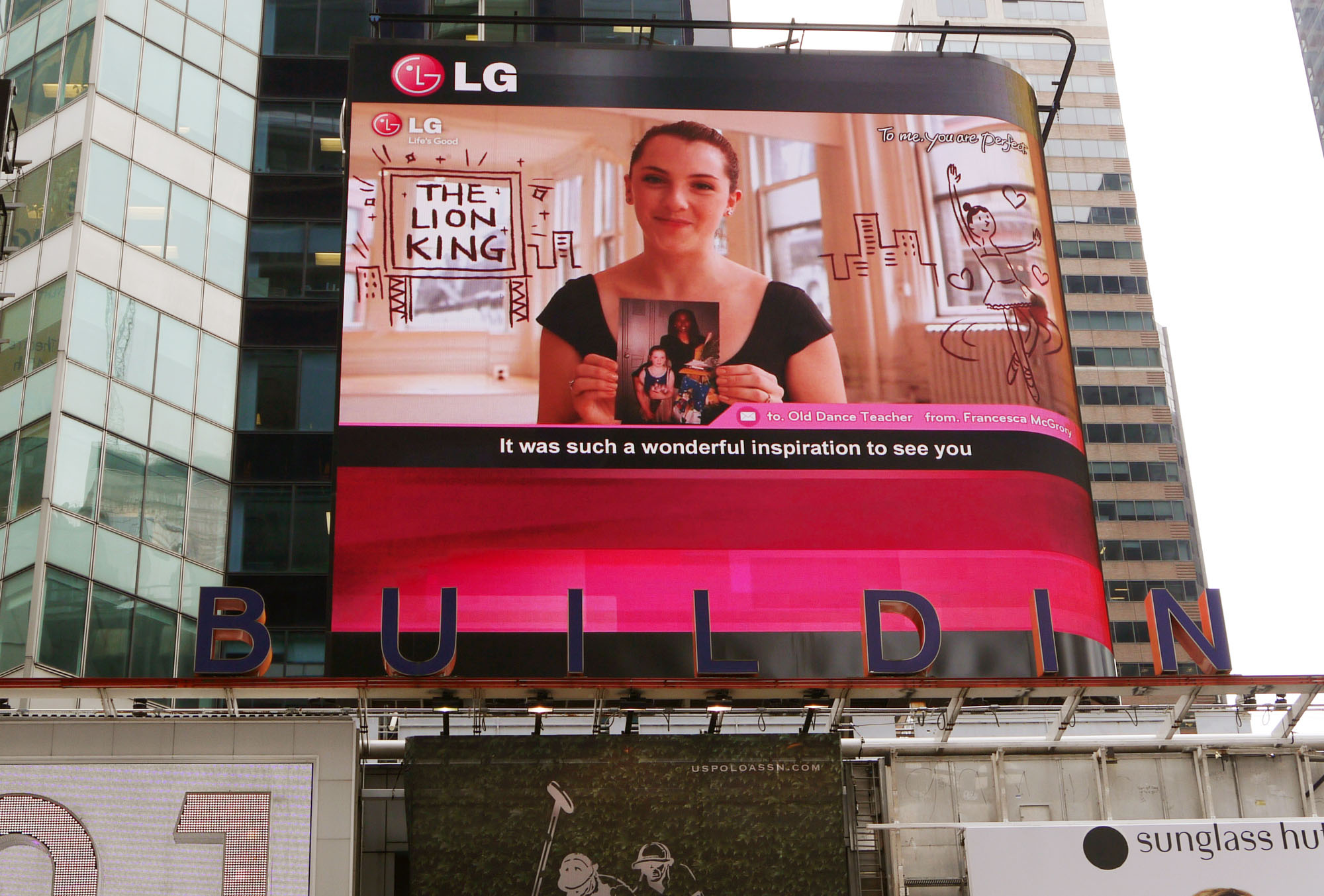 A Times Square billboard saying “To me, you are perfect. From G”