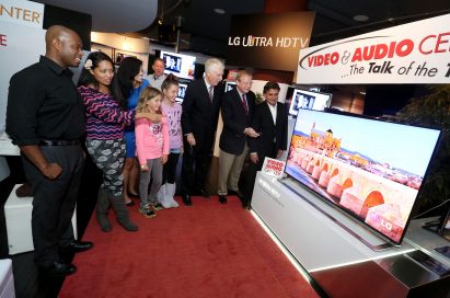 Visitors look at the LG Ultra HD TV model LA9700 on display at the Video&Audio Center