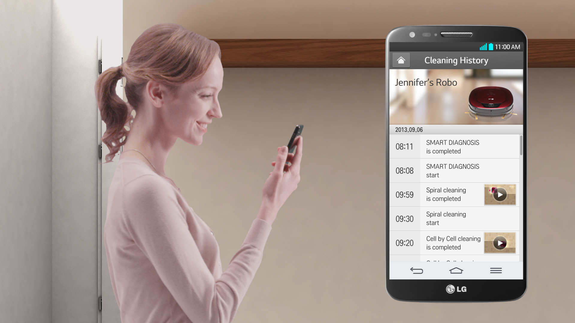 A woman monitoring her LG HOM-BOT’s cleaning history with the smart app