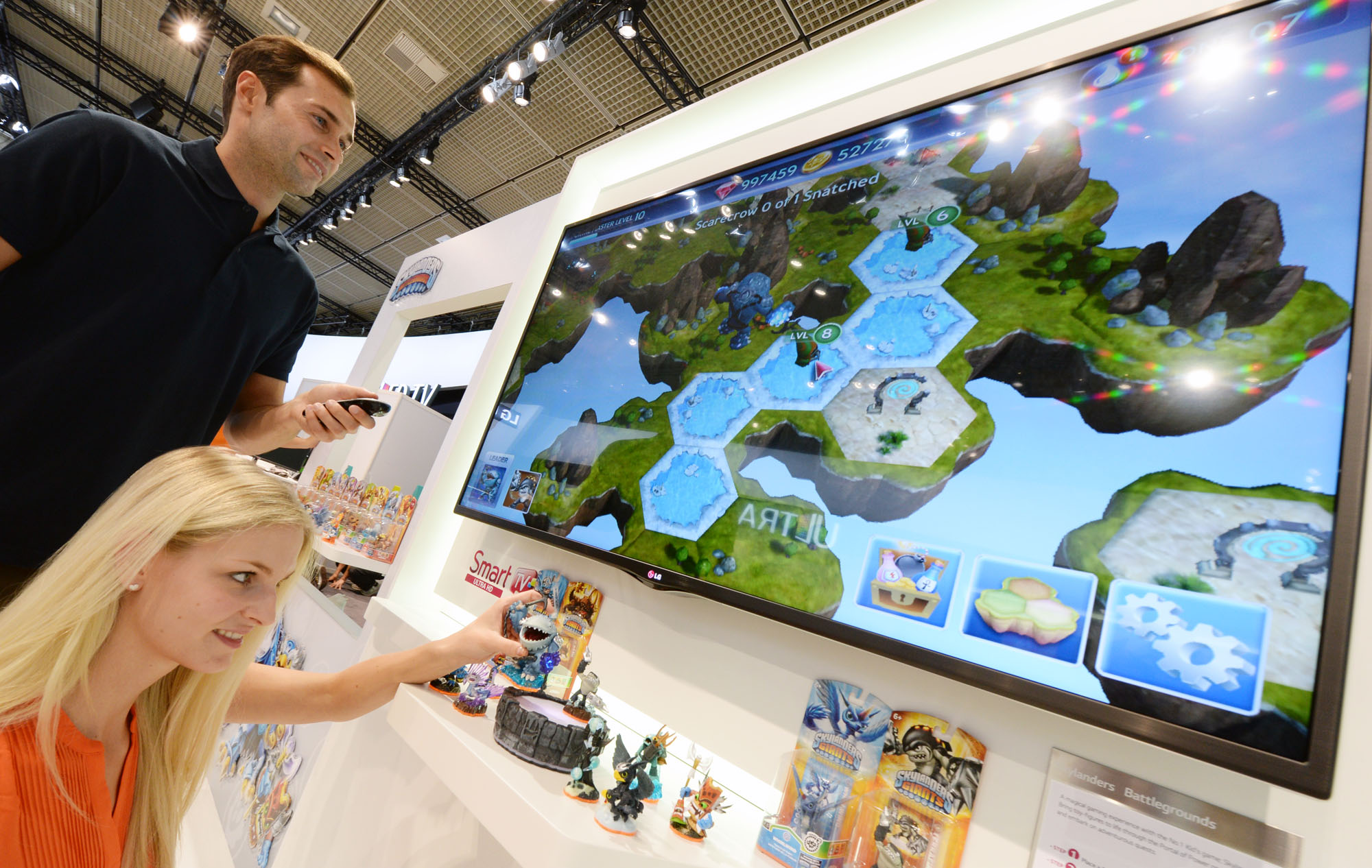 Visitors to the LG booth at IFA 2013 play popular family-friendly video game ‘Skylanders Battlegrounds®’ with the LG CINEMA 3D Smart TV