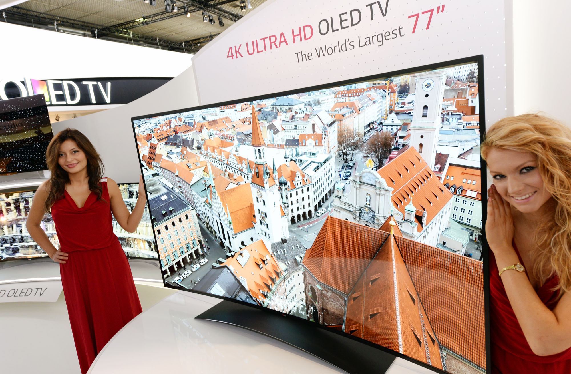 Two models presenting the 77-inch ULTRA HD OLED TV at IFA 2013