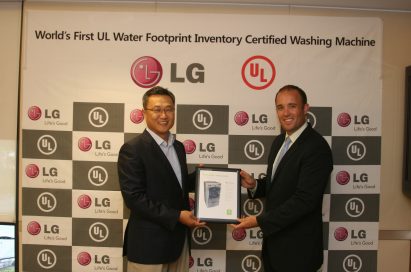 Chris Jung, president of Home Appliances at LG USA, and Sara Greenstein, president of UL Environment, holding the UL Environment certification for LG’s ultra large-capacity front-load washing machine