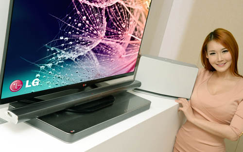 A model posing with LG’s advanced audio video lineup at 2014 CES.