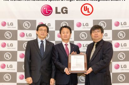 Three officials from LG and UL (Underwriters Laboratories) hold up a validation certificate from UL