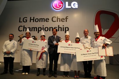 An LG representative awards the winners of the LG Home Chef Championship 2013 on the main stage with certificates and prizes.