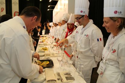 Participating chefs explain their dishes to the judges