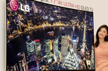 A model presenting LG’s record-breaking 77-inch 4K ULTRA HD OLED TV