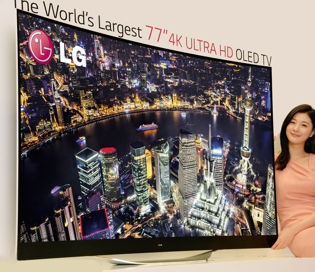 A model presenting LG’s record-breaking 77-inch 4K ULTRA HD OLED TV