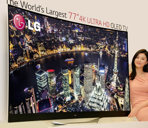 A model presenting LG’s record-breaking 77-inch 4K ULTRA HD OLED TV.