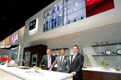 Top product designer Nate Berkus and two men from LG standing in concept kitchen featuring LG Studio lineup at CES 2014