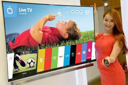 A model showing off LG’s new Smart TV platform webOS with the Magic Remote in her hand