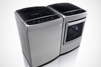 Side view of LG top-load washing machine and front-load dryer with digital control panel