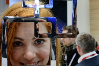 A female model is holding the trophy of the ‘Most Innovative Device Manufacturer of the Year’ by the GSMA at Mobile World Congress 2014.