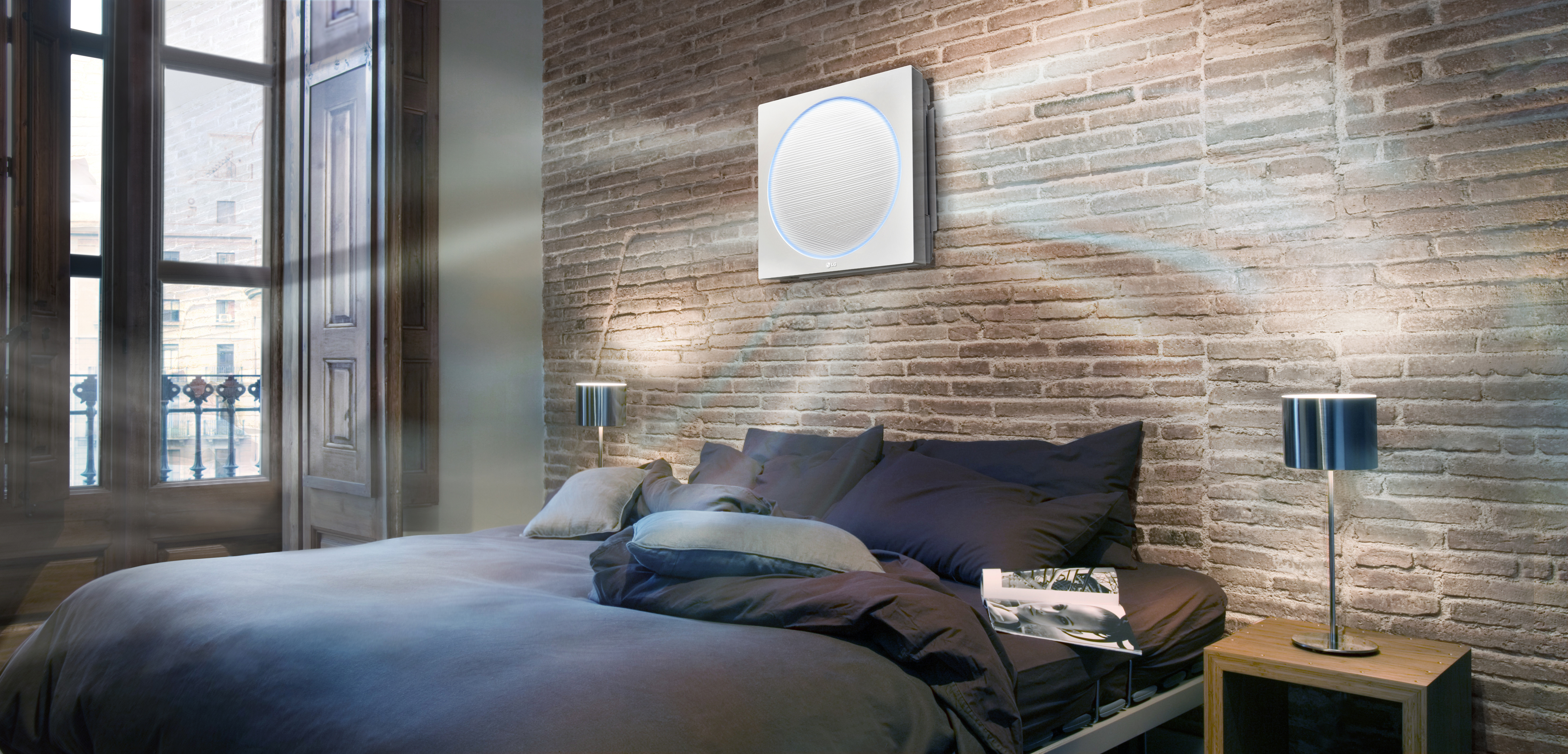 LG ARTCOOL Stylist air conditioner operating in the wall of bedroom