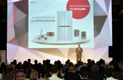 An LG representative explains the LG Refrigerator to visitors on stage at LG Innovative Festival Europe.