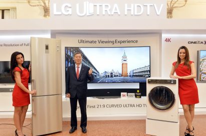 Two models demonstrating LG’s washing machine and refrigerator with vice president and Europe region head at LG Electronics, Brian Na, at LG Innovative Festival Europe