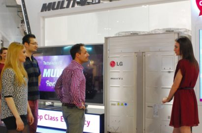 A woman explaining LG Multi V IV to the visitors to LG booth at Mostra Convegno Expocomfort 2014