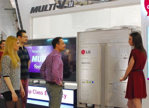 A woman explaining LG Multi V IV to the visitors to LG booth at Mostra Convegno Expocomfort 2014