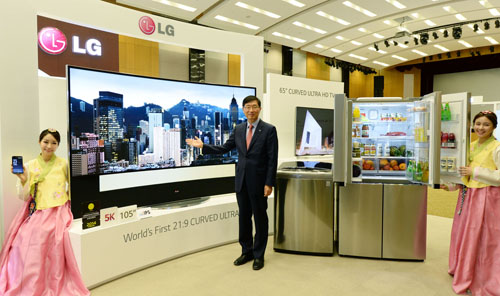 Weon-dae Kim, senior vice president and regional head of LG Electronics Asia, poses with its newest products aimed at Asian consumers.
