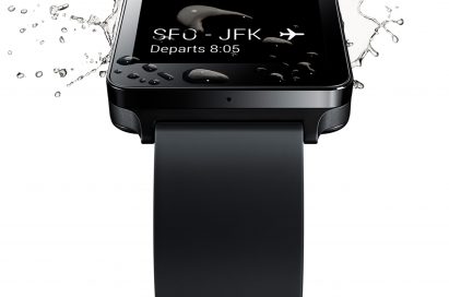 Water drops and spreads on the Titan Black LG G Watch’s screen, which is showing the user’s flight departure details.