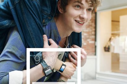 A man carrying a woman on his back while their LG watches show information in Google stocks.