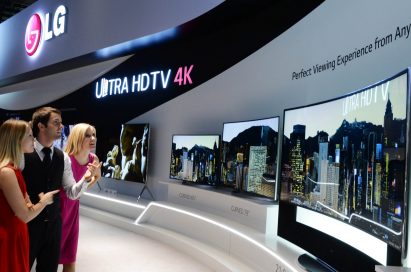 Models look at LG ULTRA HD TVs.