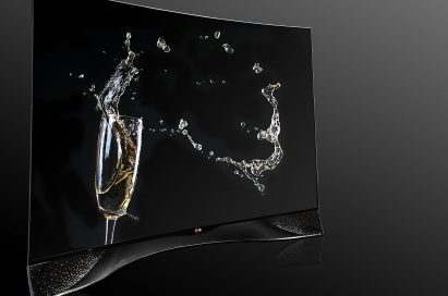 A left-side view of LG CURVED OLED TV displaying its pixel dimming technology featuring Swarovski Crystal Stand