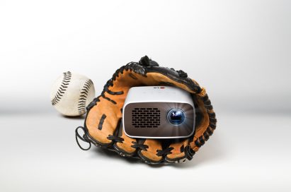 Front view of LG HD MiniBeam model PH300 held inside a baseball glove