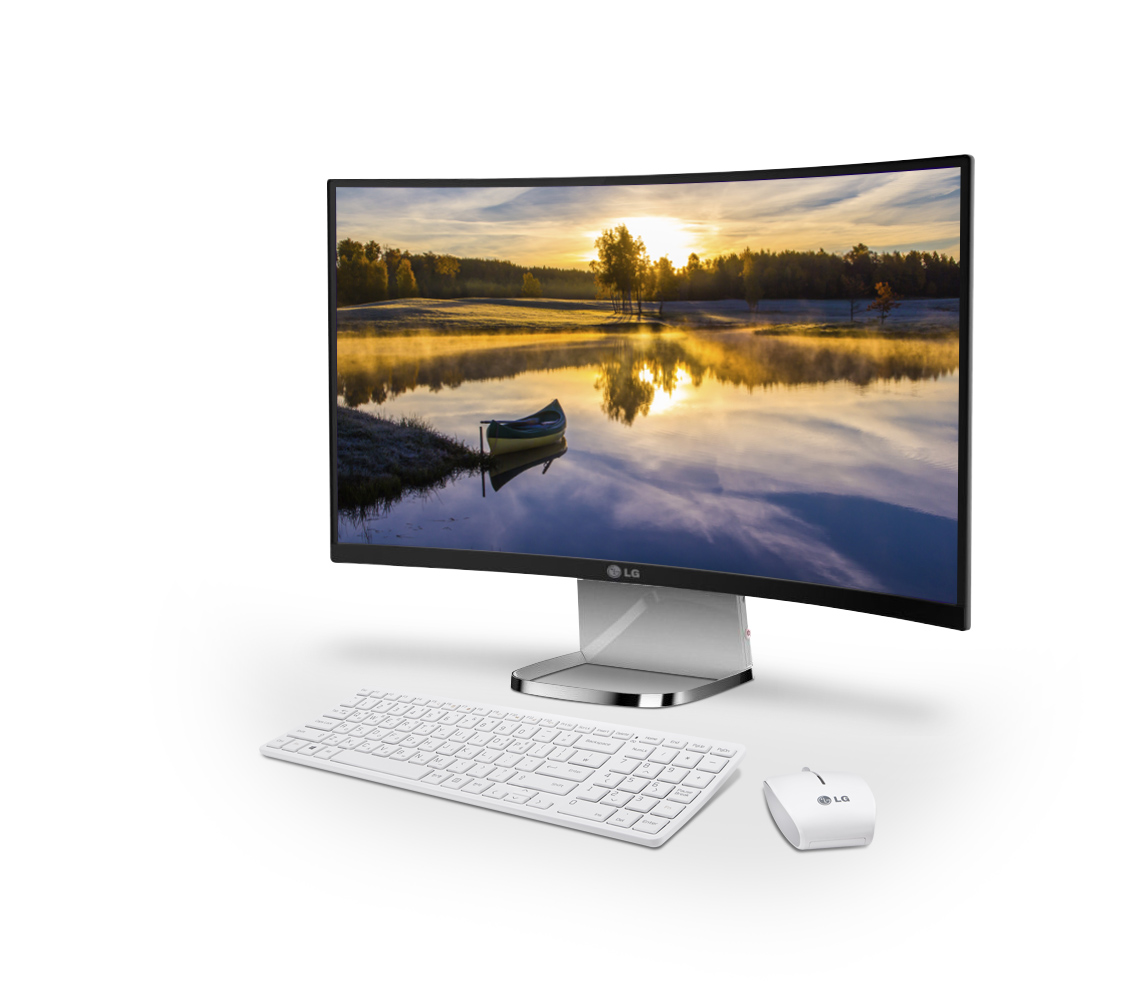 A right-side view of LG’s curved All-In-One PC model 29V950 with a keyboard and mouse at its front