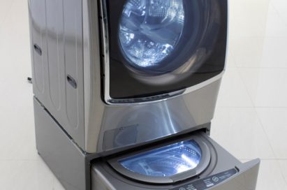 Left view of LG TWINWash™ washing machine with its Mini washer opened