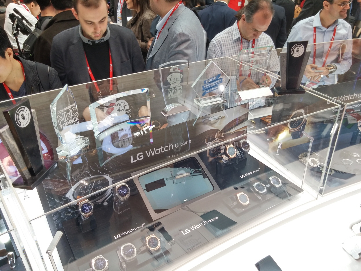 Participants of MWC are looking at LG Watch Urbanes at LG booth.
