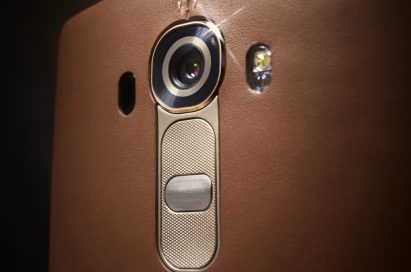 A close-up of the top of the LG G4’s back while wearing a brown leather cover.